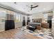 Spacious main bedroom with wood flooring, a plush bed, and large windows at 11946 E Cavedale Dr, Scottsdale, AZ 85262
