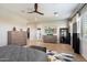Main bedroom with a large TV, walk-in closet, and plenty of natural light at 11946 E Cavedale Dr, Scottsdale, AZ 85262