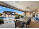 Outdoor patio with large dining table and pool view at 11946 E Cavedale Dr, Scottsdale, AZ 85262