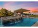 Resort-style pool and spa with waterfall feature at 11946 E Cavedale Dr, Scottsdale, AZ 85262