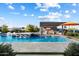 Resort-style pool and spa with outdoor seating at 11946 E Cavedale Dr, Scottsdale, AZ 85262
