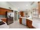 Kitchen with stainless steel appliances and wood cabinets at 14102 W White Rock Dr, Sun City West, AZ 85375