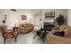 Open living room with neutral color palette, comfortable sofas, and a flat-screen TV at 14102 W White Rock Dr, Sun City West, AZ 85375