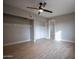 Large bedroom with walk-in closet and wood floors at 1501 W Grovers Ave, Phoenix, AZ 85023