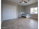 Bedroom with double door closet and wood-look floors at 1501 W Grovers Ave, Phoenix, AZ 85023