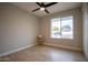 Bright bedroom with laminate flooring and a large window at 1501 W Grovers Ave, Phoenix, AZ 85023