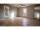 Spacious bedroom with hardwood floors and ceiling fan at 1501 W Grovers Ave, Phoenix, AZ 85023