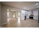 Open concept kitchen with white cabinets, stainless steel appliances, and a view into the living area at 1501 W Grovers Ave, Phoenix, AZ 85023