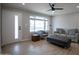 Bright living room with hardwood floors, new paint, and ample natural light at 1501 W Grovers Ave, Phoenix, AZ 85023