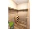 Large walk-in closet with shelving and hanging rods at 205 S Higley Rd # 218, Mesa, AZ 85206