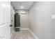 Functional laundry room with tile flooring and water heater at 2630 N 49Th Ln, Phoenix, AZ 85035