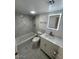 Updated bathroom with new vanity and bathtub at 3131 W Cochise Dr # 165, Phoenix, AZ 85051