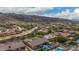 Aerial view of house with pool and mountain views at 3234 E Ian Dr, Phoenix, AZ 85042