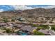 Aerial view of home with pool and mountain views at 3234 E Ian Dr, Phoenix, AZ 85042