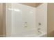 Clean bathroom with a white bathtub and shower combination at 3234 E Ian Dr, Phoenix, AZ 85042