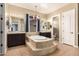 Elegant bathroom with soaking tub and double vanities at 3234 E Ian Dr, Phoenix, AZ 85042