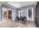 Elegant dining room with a table for four, and access to the entryway at 3234 E Ian Dr, Phoenix, AZ 85042