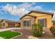 One-story home with stone exterior and lush landscaping at 3234 E Ian Dr, Phoenix, AZ 85042
