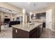 Large kitchen island with granite countertops and a view into the living room at 3234 E Ian Dr, Phoenix, AZ 85042