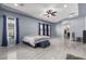 Spacious main bedroom with a ceiling fan and large windows at 3234 E Ian Dr, Phoenix, AZ 85042