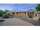 Covered patio, brick pavers, and a fire pit highlight this backyard oasis at 40512 N Candlewyck Ln, Phoenix, AZ 85086