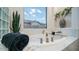 Relaxing bathroom featuring a large soaking tub and natural light at 40512 N Candlewyck Ln, Phoenix, AZ 85086