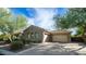 Two car garage with neutral colored door and stone accents at 40512 N Candlewyck Ln, Phoenix, AZ 85086