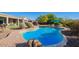 Inviting kidney-shaped pool with brick coping and lounge chairs at 40512 N Candlewyck Ln, Phoenix, AZ 85086