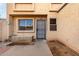 Front entry of a two-story home with a security door and a small window at 4428 E Wood St # 595, Phoenix, AZ 85040