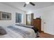 Bedroom with metal bed frame and built-in dresser at 5709 E Beck Ln, Scottsdale, AZ 85254