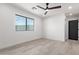 Bright and airy bedroom with ceiling fan and light colored flooring at 6425 S Rockford Dr, Tempe, AZ 85283