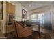 Bright home office with large desk, comfortable chair, and natural light at 650 N Hawes Rd # 2860, Mesa, AZ 85207