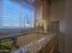 Kitchen sink with granite countertop and tile backsplash at 650 N Hawes Rd # 2860, Mesa, AZ 85207