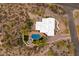 Aerial view of a house with pool and desert landscaping at 7614 E Rocking Chair Rd, Carefree, AZ 85377