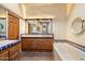 Bathroom with double vanities, tiled counters and bathtub at 7614 E Rocking Chair Rd, Carefree, AZ 85377