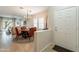 Bright dining area with a wood table and orange chairs at 8404 S Thorne Mine Ln, Gold Canyon, AZ 85118