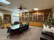 Community library featuring bookshelves, a conference table, and a Christmas tree at 8500 E Southern Ave # 550, Mesa, AZ 85209