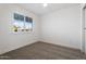 Well-lit bedroom with carpet flooring and window at 903 E Campus Dr, Tempe, AZ 85282