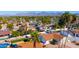 An aerial view showcasing the home, pool, and surrounding neighborhood at 9330 E Kalil Dr, Scottsdale, AZ 85260