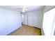 Bedroom with wood-look tile, ceiling fan, and closet at 9330 E Kalil Dr, Scottsdale, AZ 85260