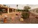 Spacious backyard with a patio, fountain, and decorative landscaping at 10723 E Navajo Pl, Sun Lakes, AZ 85248