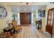 Elegant entryway with hardwood floors and decorative furniture at 10723 E Navajo Pl, Sun Lakes, AZ 85248