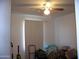 Small bedroom with window and ceiling fan at 14125 W Noble Cir, Casa Grande, AZ 85122