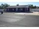 Purple house with a driveway and street view at 14125 W Noble Cir, Casa Grande, AZ 85122