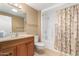 Well-maintained bathroom, featuring a vanity with wood cabinets at 18001 N 99Th Dr, Sun City, AZ 85373