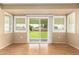 Dining room with hardwood floors, sliding glass doors, and backyard view at 18001 N 99Th Dr, Sun City, AZ 85373