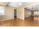 Dining area with wood flooring and access to laundry and living room at 18001 N 99Th Dr, Sun City, AZ 85373