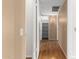 Long hallway with light walls, wood flooring, and a closet at 18001 N 99Th Dr, Sun City, AZ 85373