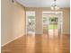 Living room with hardwood floors and a view of the front yard at 18001 N 99Th Dr, Sun City, AZ 85373