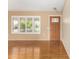 Living room features wood flooring and a sliding glass door at 18001 N 99Th Dr, Sun City, AZ 85373